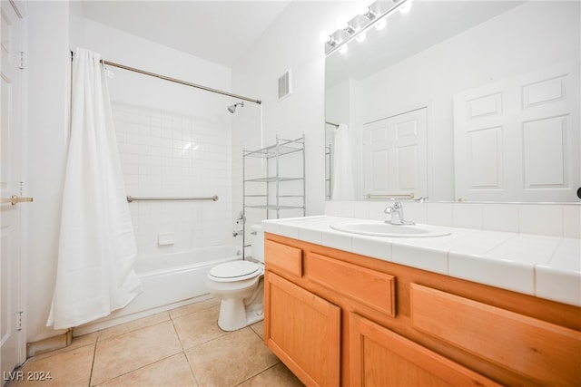 full bathroom with vanity, toilet, tile patterned floors, and shower / bath combination with curtain