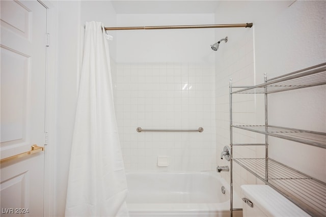 bathroom with toilet and shower / bath combination with curtain