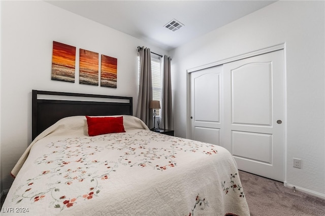 carpeted bedroom with a closet