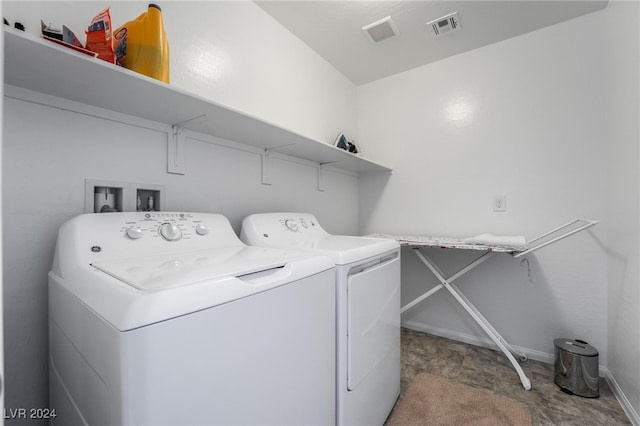 washroom with washer and clothes dryer