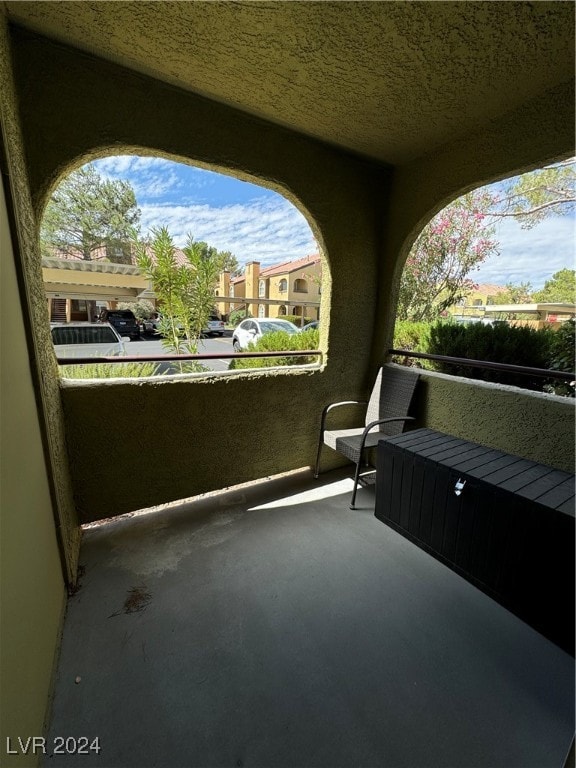 view of patio featuring a balcony