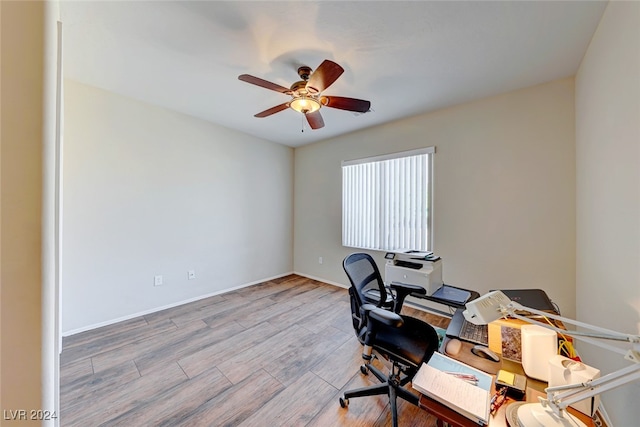 office space with light wood-type flooring and ceiling fan