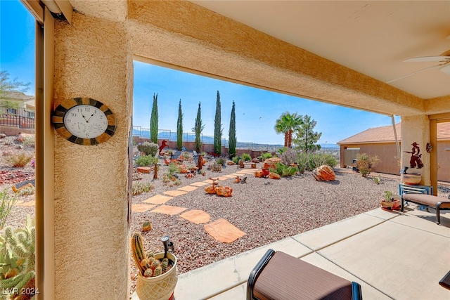 view of patio / terrace featuring ceiling fan