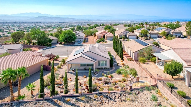 birds eye view of property featuring a mountain view