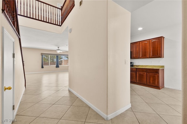 corridor featuring light tile patterned floors