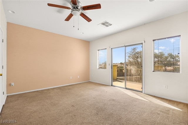 carpeted empty room with ceiling fan