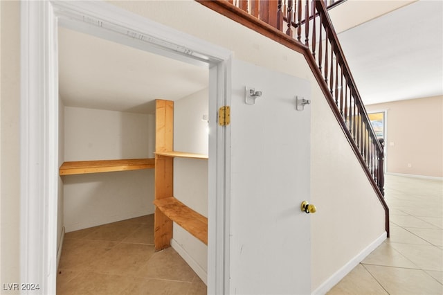 staircase with tile patterned flooring