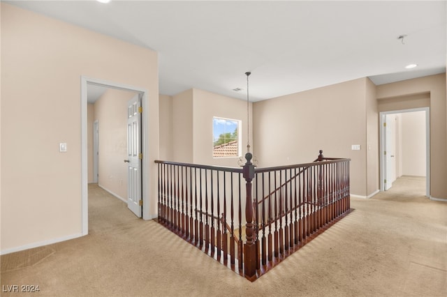 hallway with light carpet