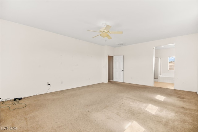 carpeted empty room with ceiling fan