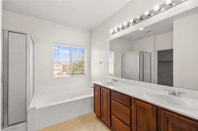 bathroom with shower with separate bathtub and vanity