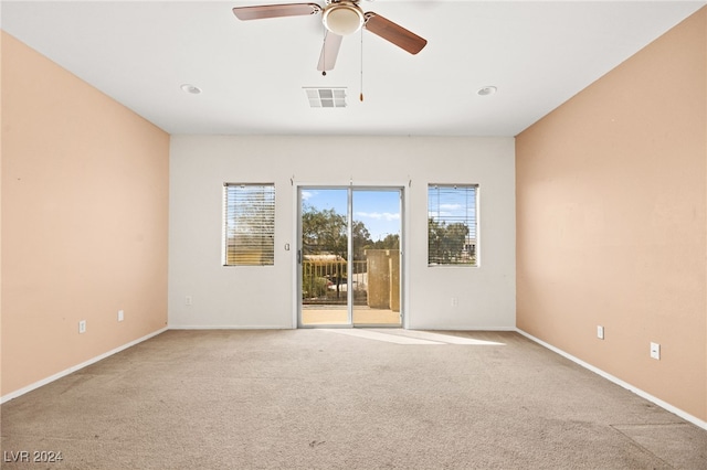 carpeted empty room with ceiling fan