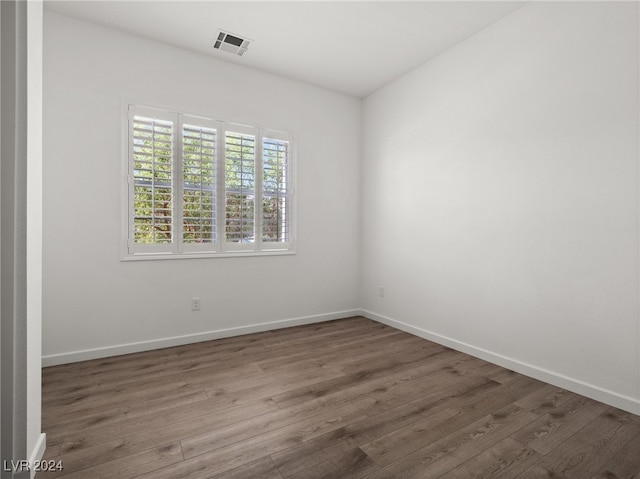 empty room featuring dark hardwood / wood-style floors