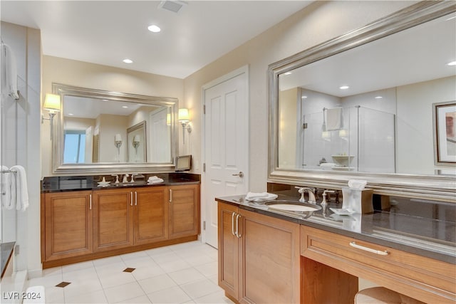 bathroom with walk in shower and vanity