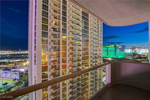 view of balcony at twilight