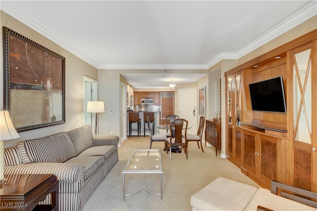 carpeted living room featuring ornamental molding