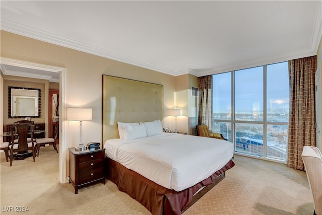 bedroom featuring ornamental molding, light carpet, and expansive windows