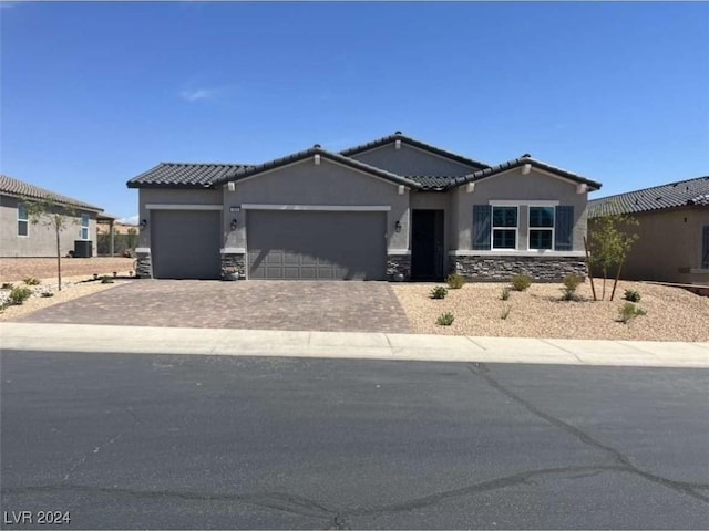 view of front of property with a garage