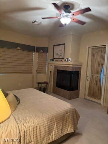 bedroom featuring ceiling fan and carpet flooring