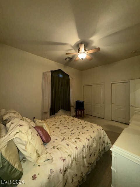 carpeted bedroom with ceiling fan