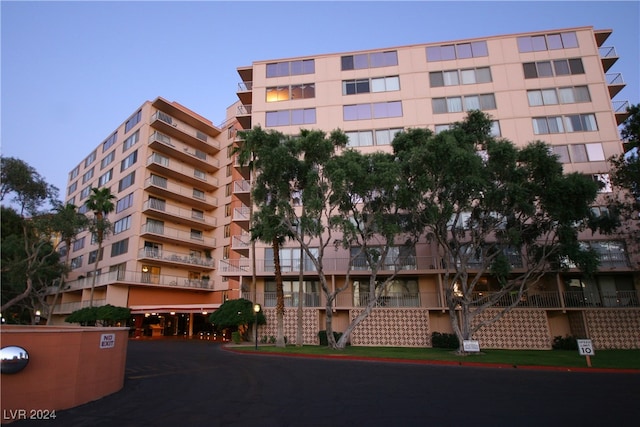 view of outdoor building at dusk