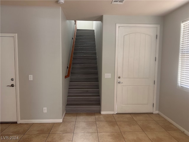 foyer with light tile patterned floors