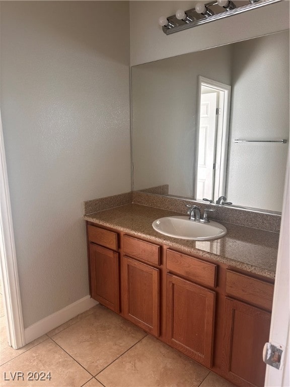 bathroom with tile patterned flooring and vanity