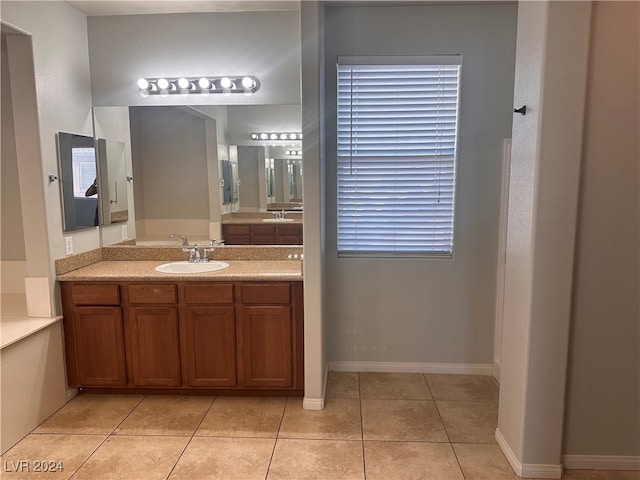 bathroom with tile patterned flooring and vanity