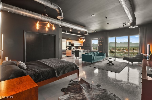 bedroom featuring concrete flooring