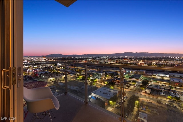 balcony at dusk with a mountain view