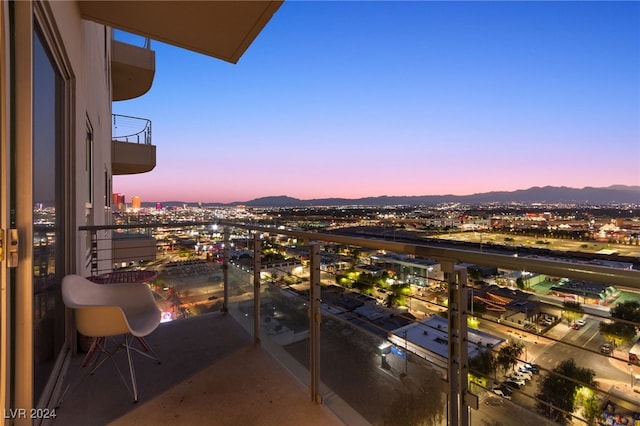 balcony at dusk with a mountain view