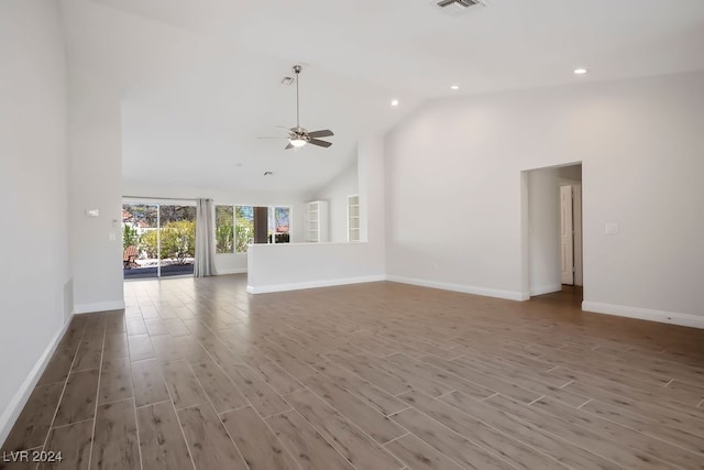 unfurnished living room featuring ceiling fan, hardwood / wood-style floors, and high vaulted ceiling