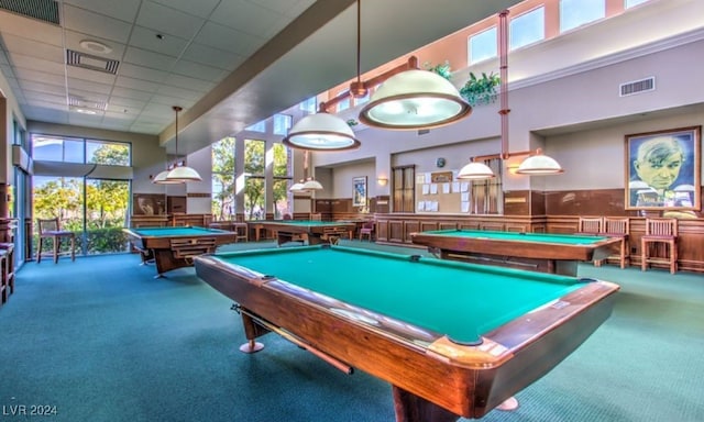 rec room featuring carpet flooring, a paneled ceiling, a towering ceiling, and billiards