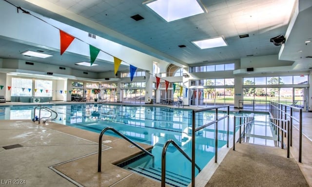 view of swimming pool with a skylight