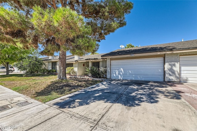 ranch-style house featuring a garage