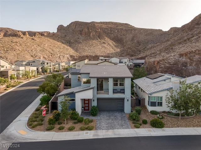 view of front of house featuring a mountain view and a garage