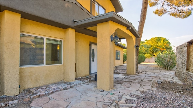 rear view of property featuring a patio