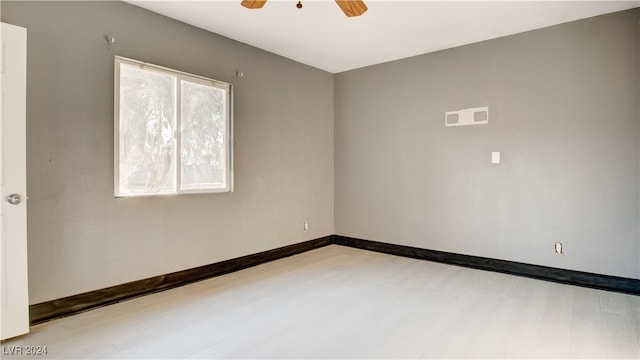 empty room featuring ceiling fan and light hardwood / wood-style floors