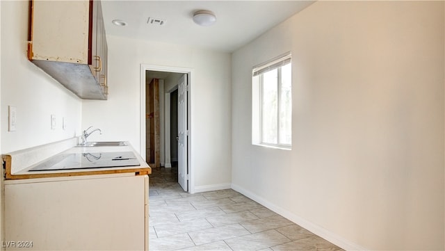 kitchen with sink and black electric stovetop