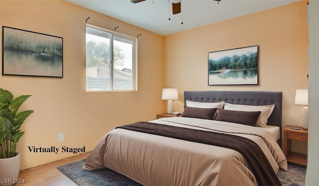 bedroom with light hardwood / wood-style flooring and ceiling fan