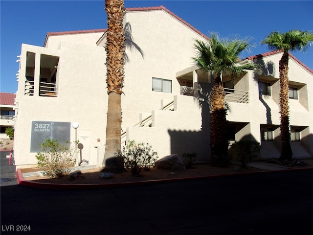 view of property exterior with a balcony