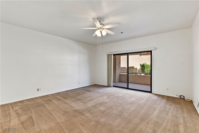 spare room featuring ceiling fan and carpet flooring