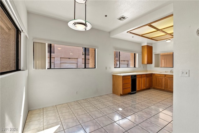 kitchen featuring sink, hanging light fixtures, and light tile patterned floors