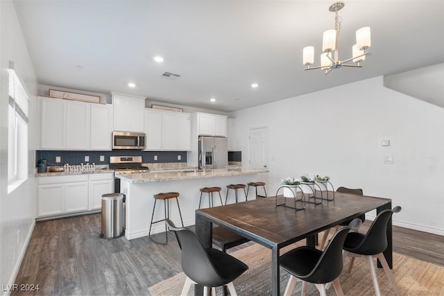 dining room featuring visible vents, baseboards, a chandelier, recessed lighting, and dark wood-style floors