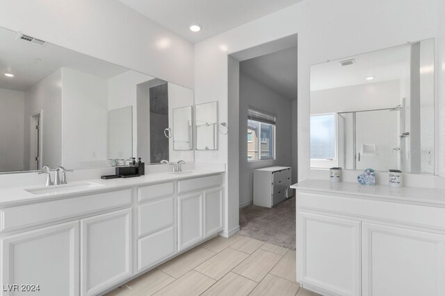 full bathroom with a sink, visible vents, a shower, and double vanity