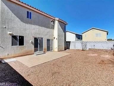 back of property featuring a patio area