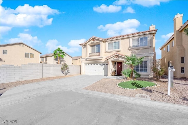 mediterranean / spanish-style home featuring fence, stucco siding, a chimney, concrete driveway, and a garage