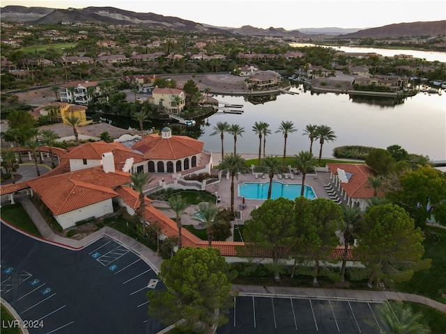 birds eye view of property featuring a water and mountain view