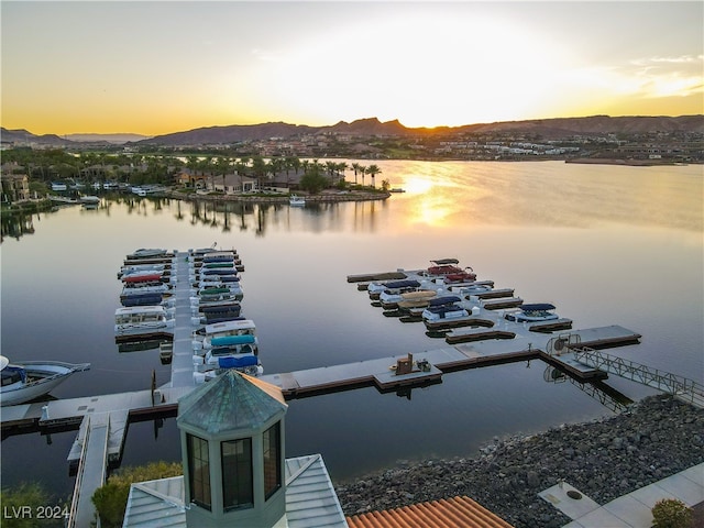 water view with a dock and a mountain view