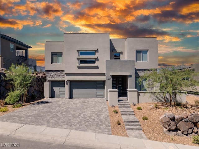 510 Duvet Ct, Henderson, NV 89012 - contemporary house featuring stucco siding, decorative driveway, and a garage