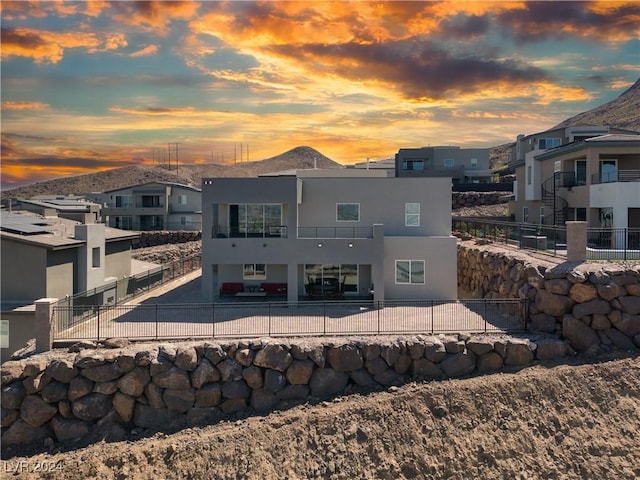 510 Duvet Ct, Henderson, NV 89012 - rear view of house with stucco siding, a fenced backyard, a balcony, and a patio